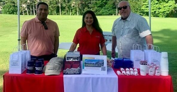 ACB members standing by their table.